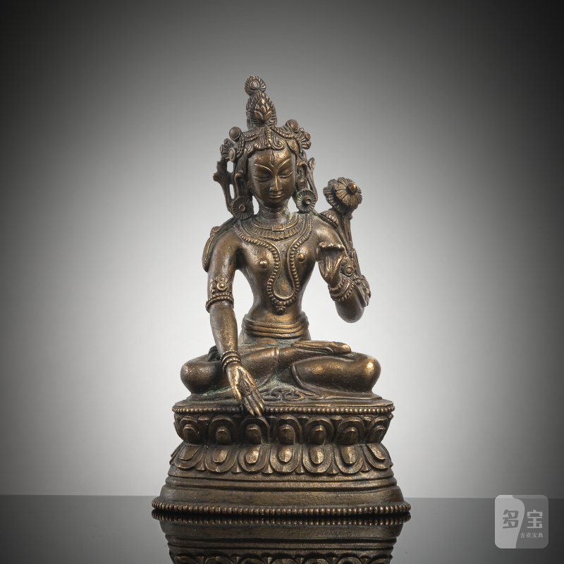 A BRONZE FIGURE OF A TARA